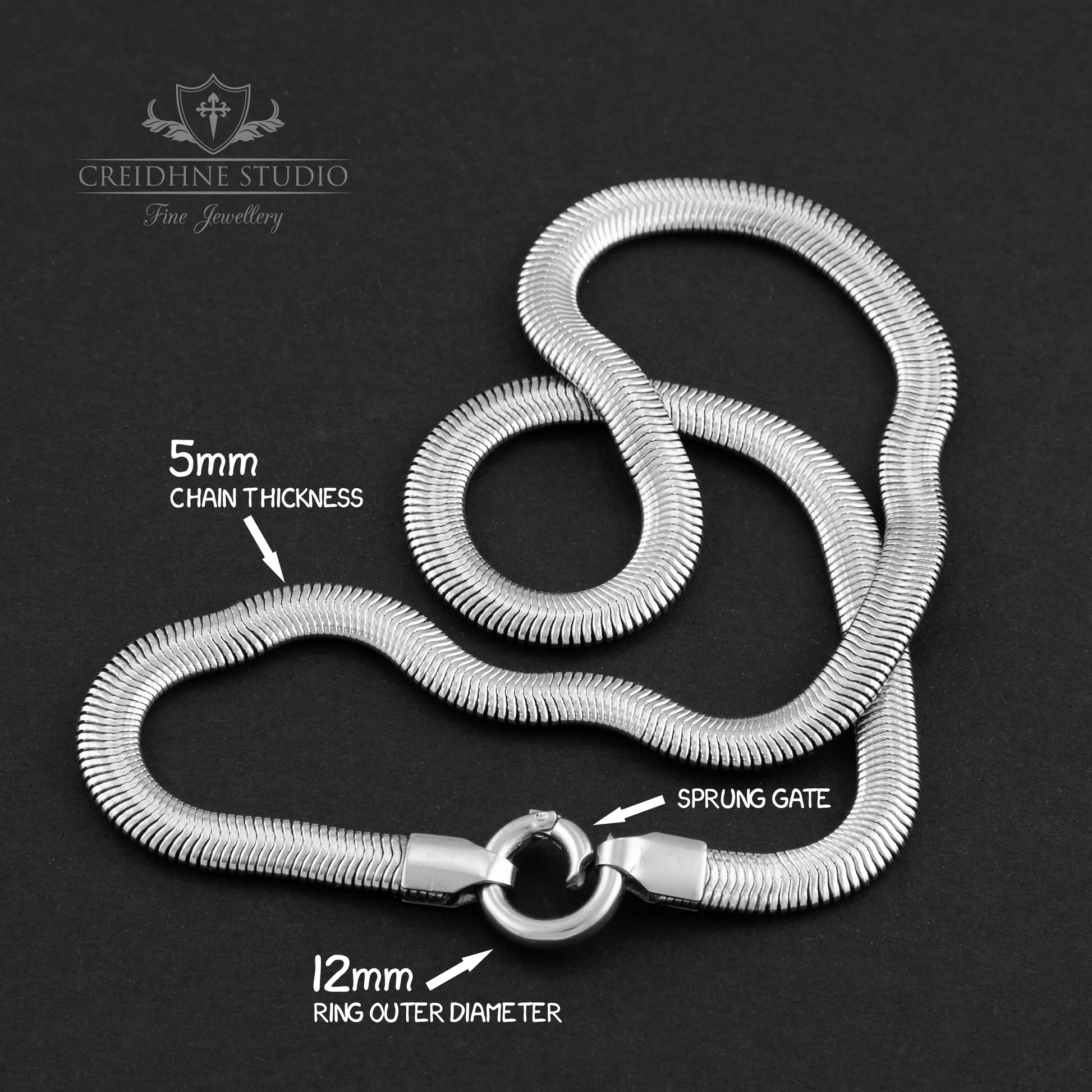 Silver snake chain necklace with measurements on a black background, branded 'Creidhne Studio'.