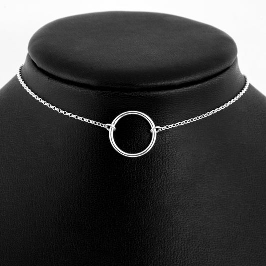 Silver day collar consisting of a delicate silver chain with a medium 20mm diameter O ring suspended in the centre. The O ring is made of 1.8mm thick silver wire.