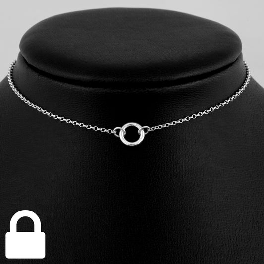 Permanently locking silver day collar consisting of a delicate silver chain with a tiny 10mm diameter O ring suspended in the centre. The O ring is made of 1.8mm thick silver wire.