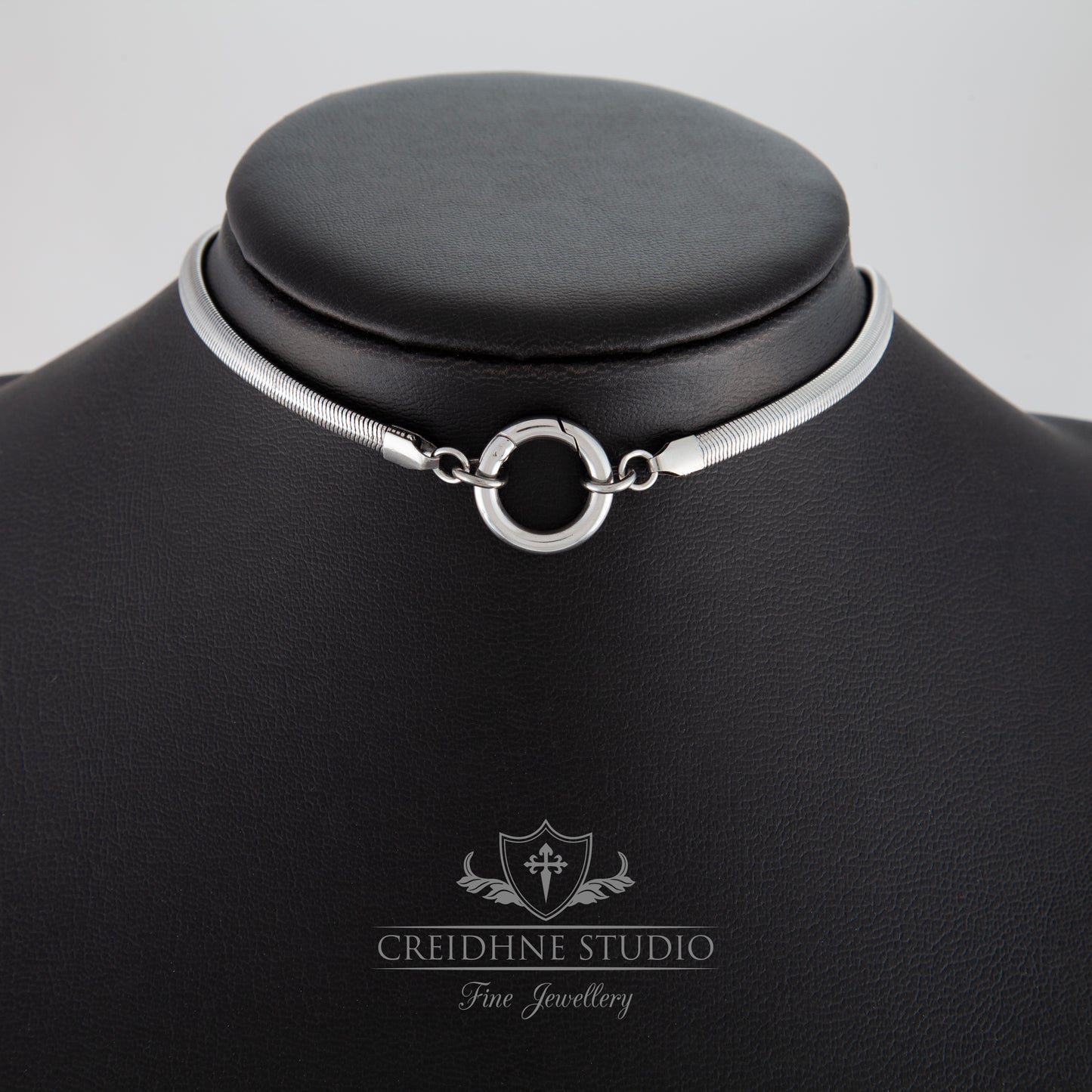 Silver snake chain necklace (collar) on a black mannequin with 'Creidhne Studio' branding.