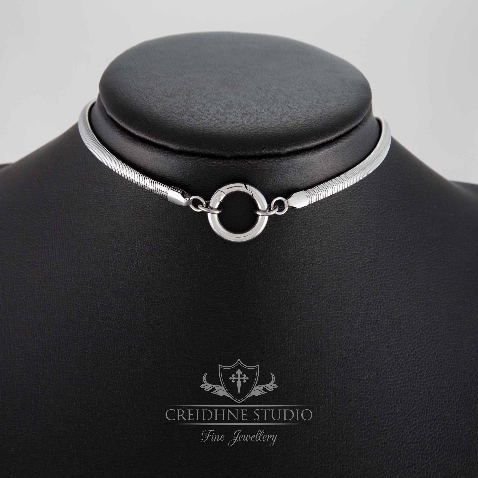 Silver snake chain necklace (collar) on a black mannequin with 'Creidhne Studio' branding.