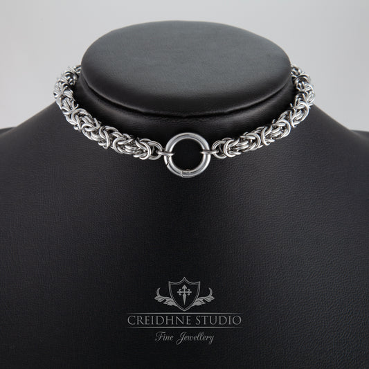 Silver chain necklace on a black mannequin with Creidhne Studio logo.